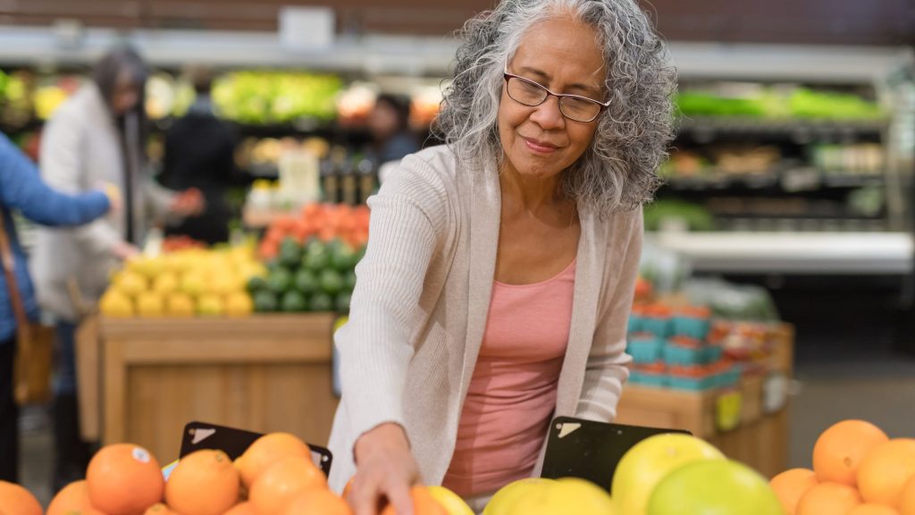 Woman Buying Fresh Fruits