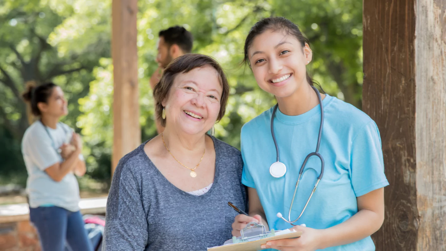 Healthcare Worker with Patient Smiling