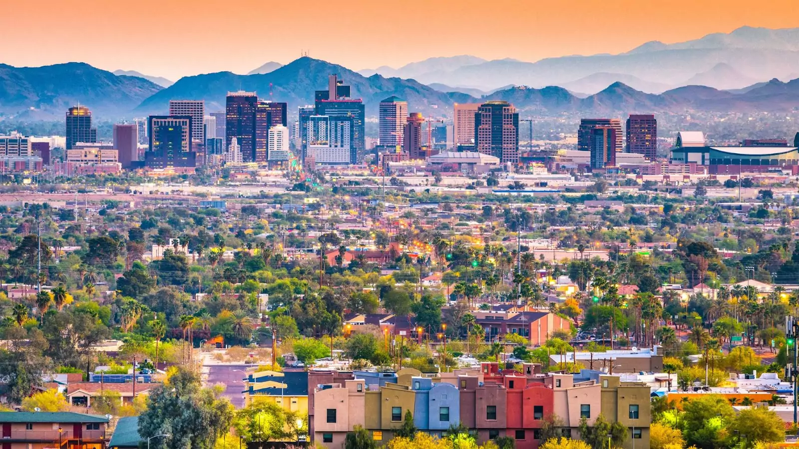 A view of a city with mountains in the background