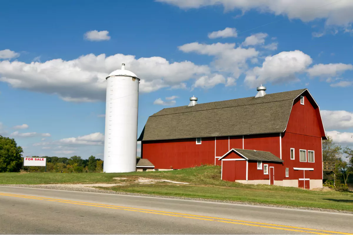 A charming red barn with a white silo