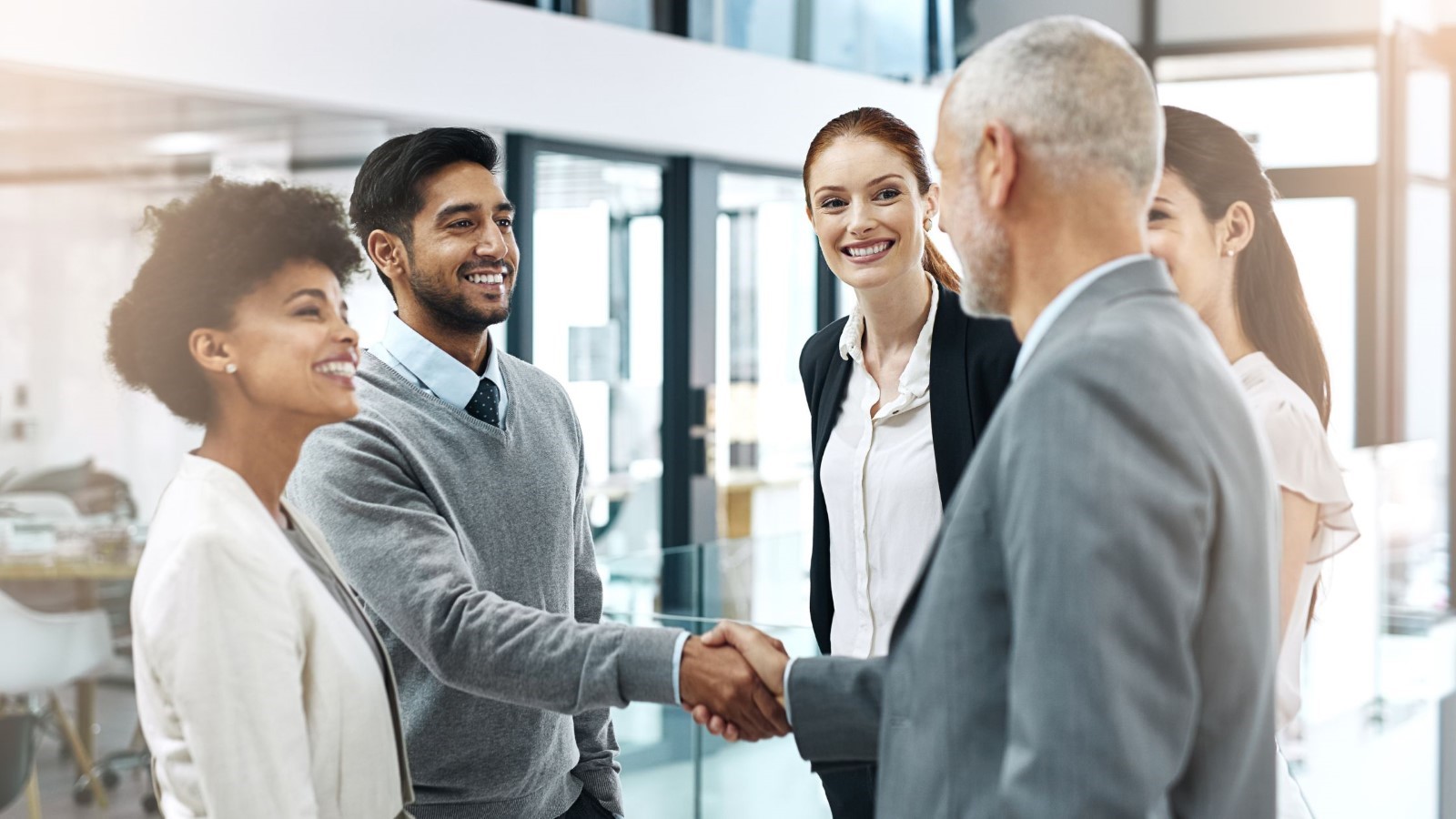 A group of people shaking hands