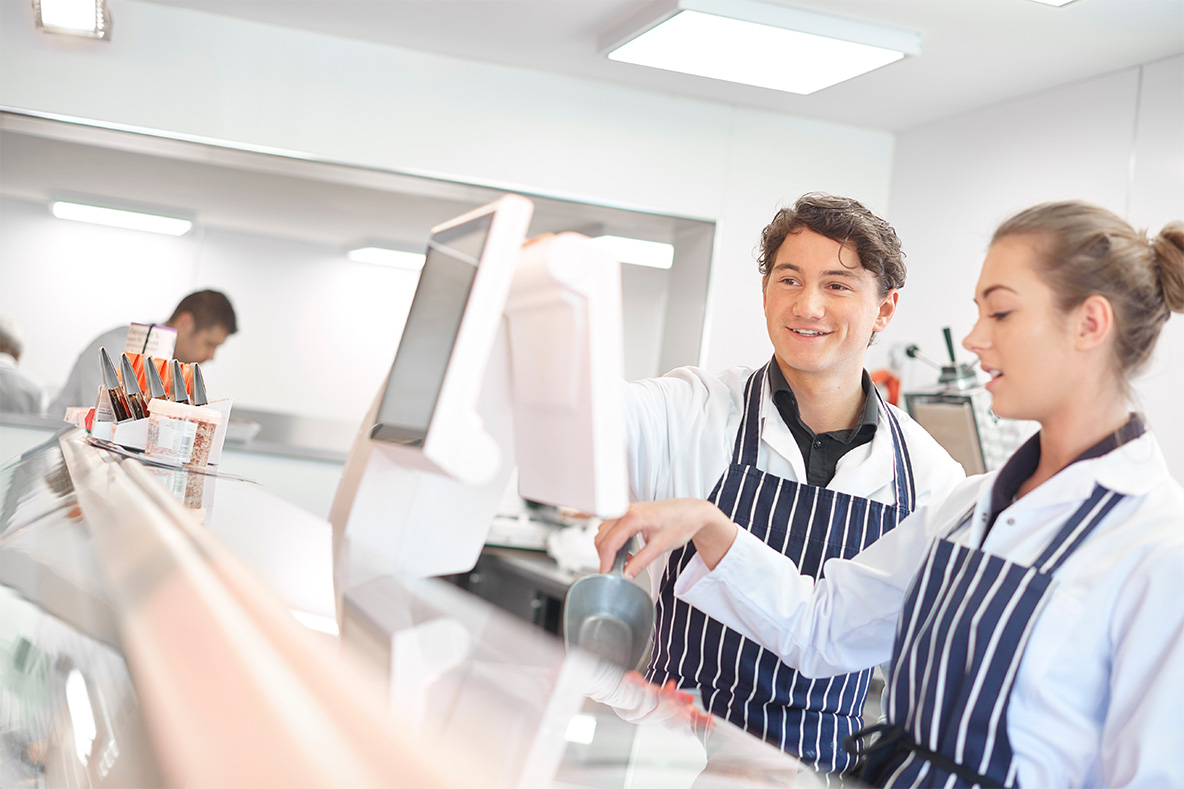 Two meat processing employee at work