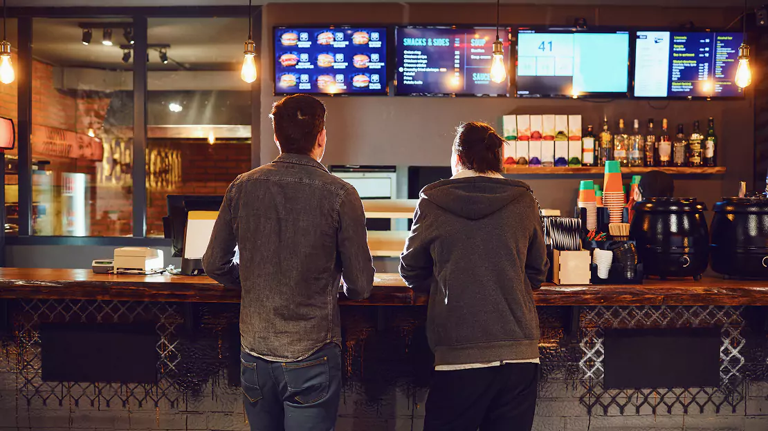 Two Men Ordering from the Menu - Restaurant