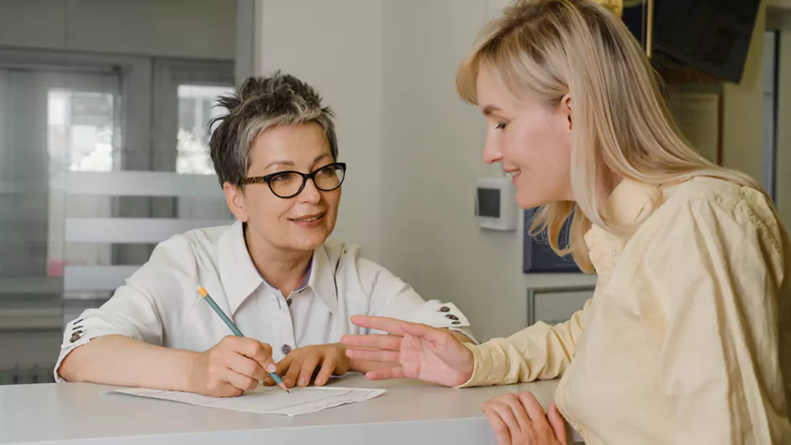 A person looking at another person - Audiology