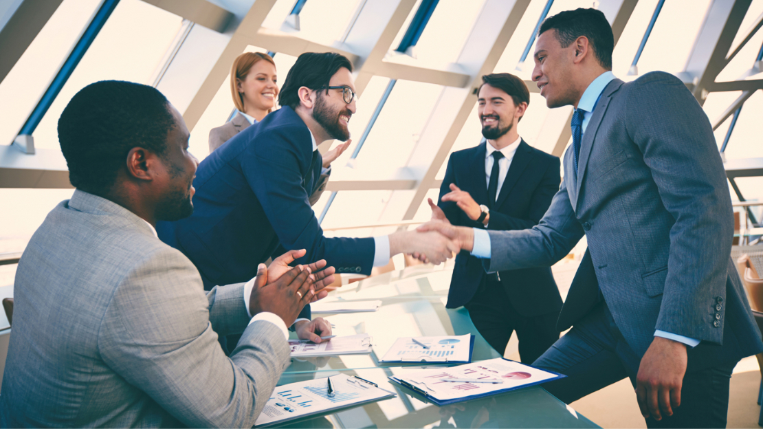 Two People Shake Hands - Business Deal Strategies