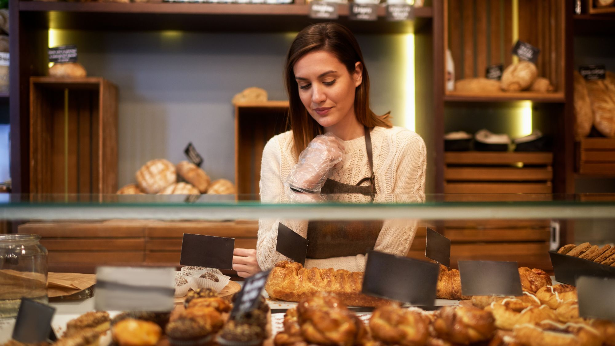 A woman working at a bakery