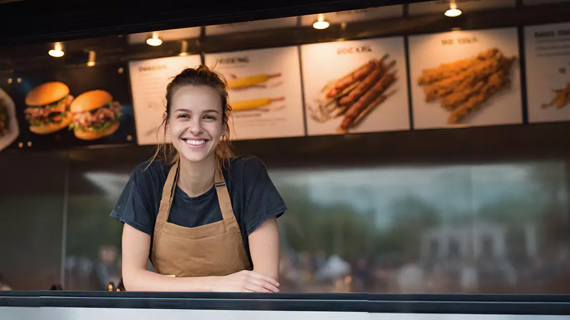 Smiling Woman Wearing an Apron