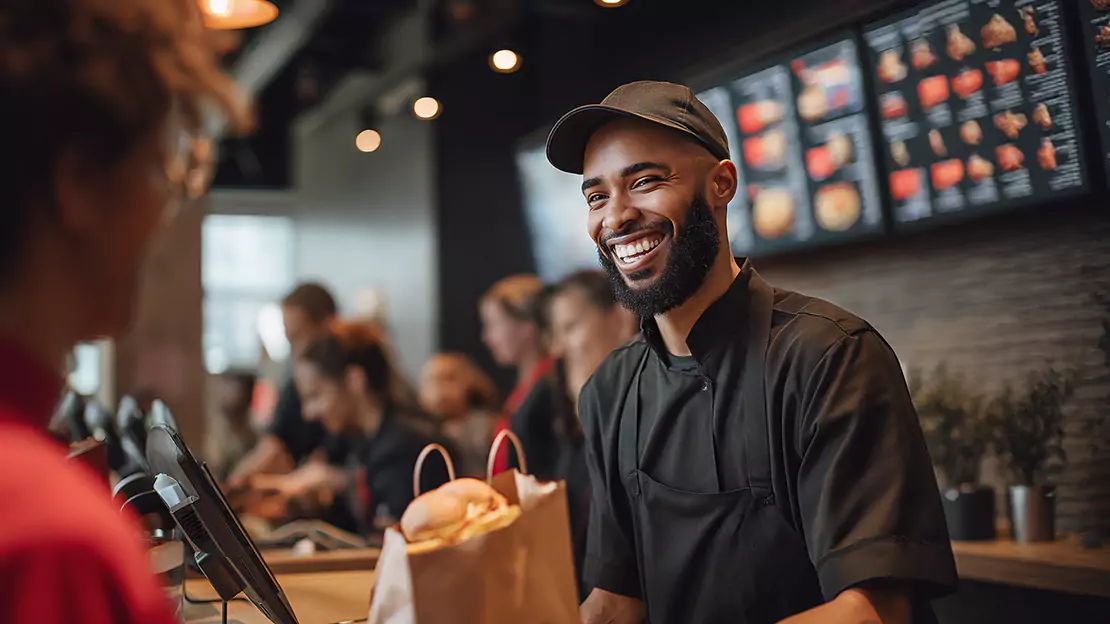 The staff is happily serving the customer