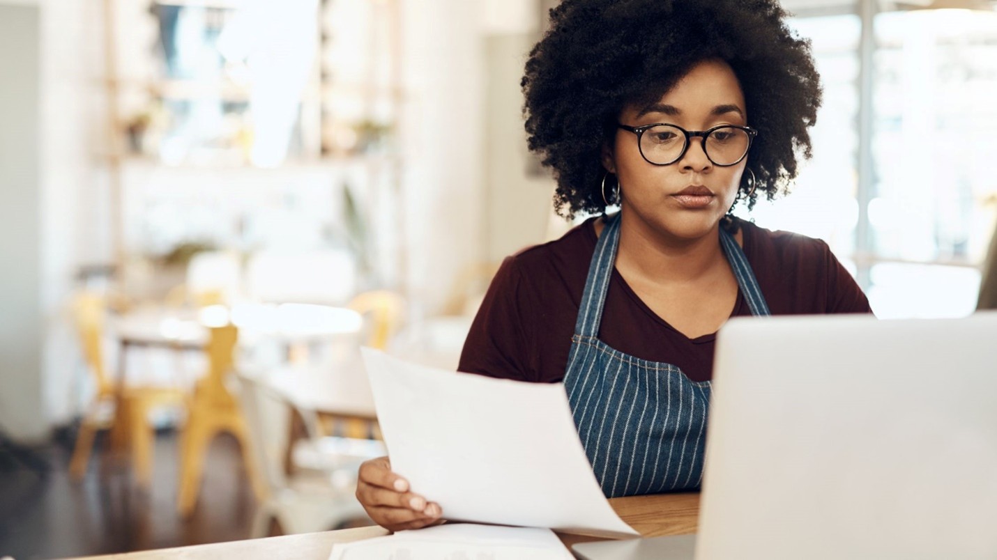 A woman looking at a paper
