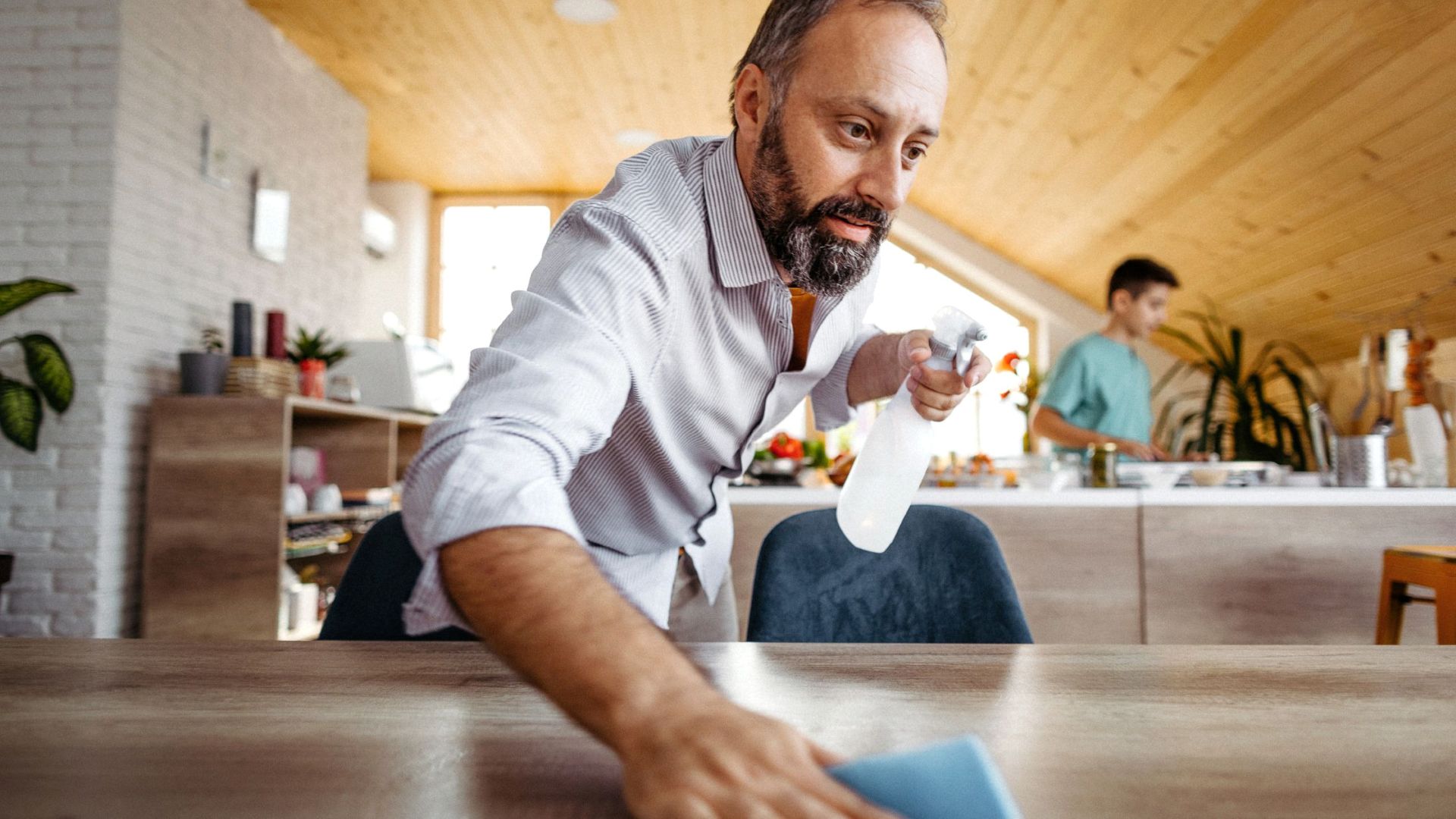 Man cleaning a table
