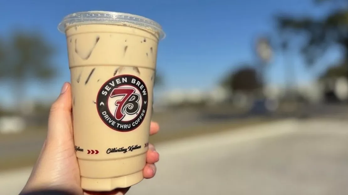 Hand Holding Seven Brew's Iced Drink