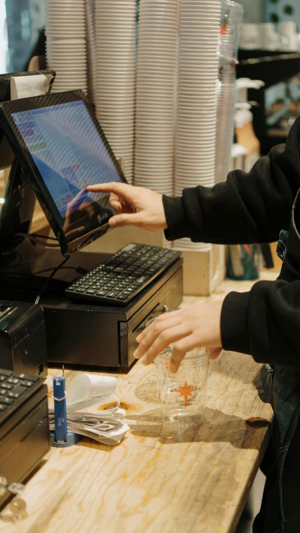 Hand touching Kiosk monitor