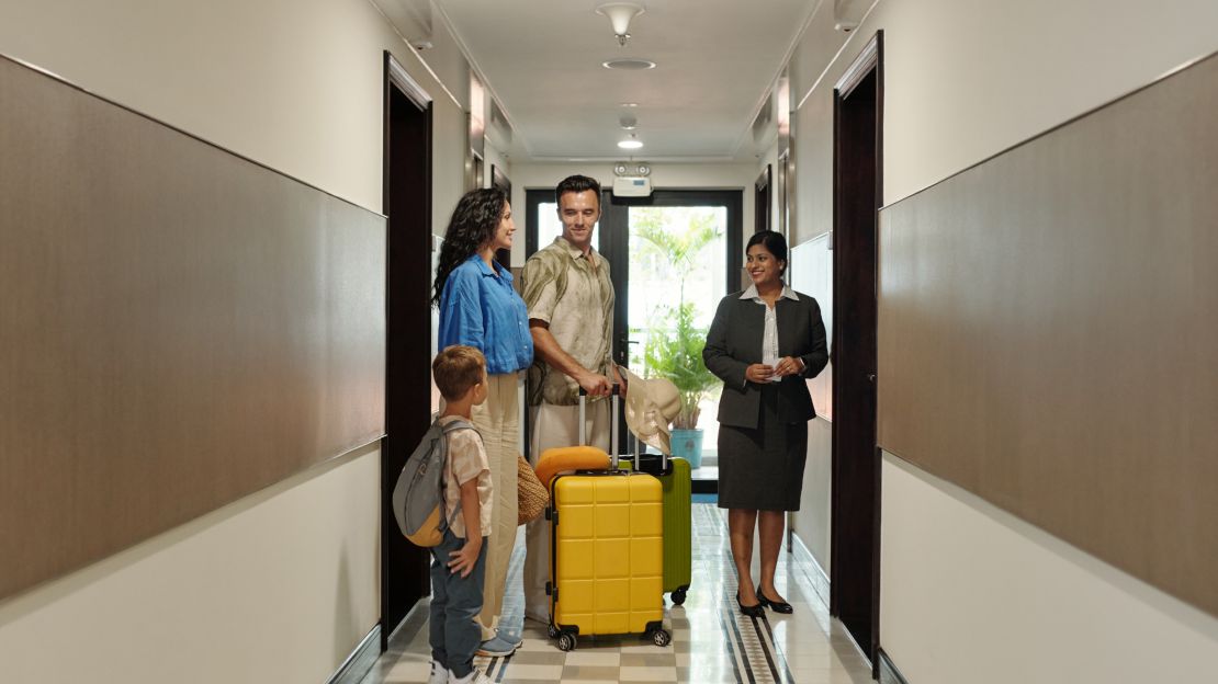 Family Entering to Hotel Room