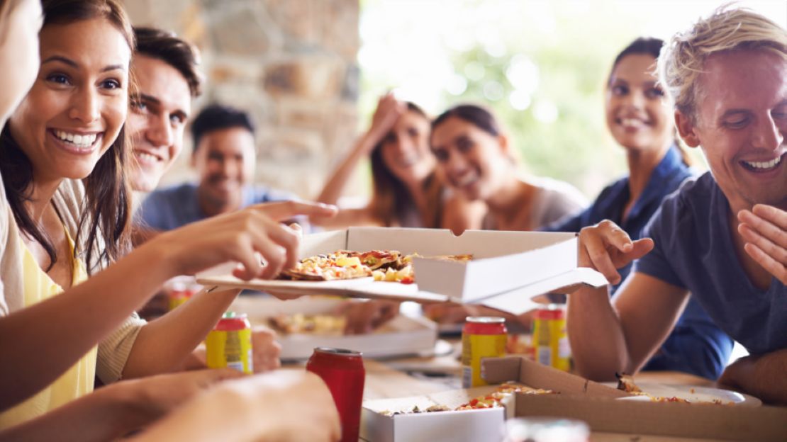 Group of people enjoying the Pizza