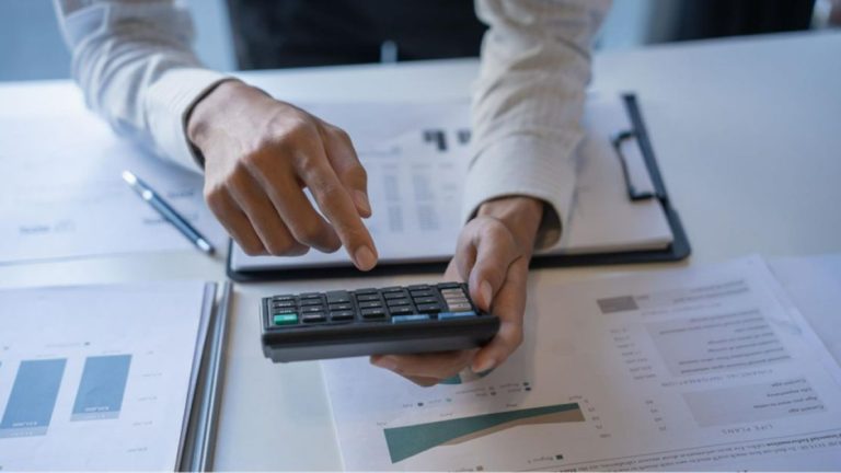 A person using a calculator