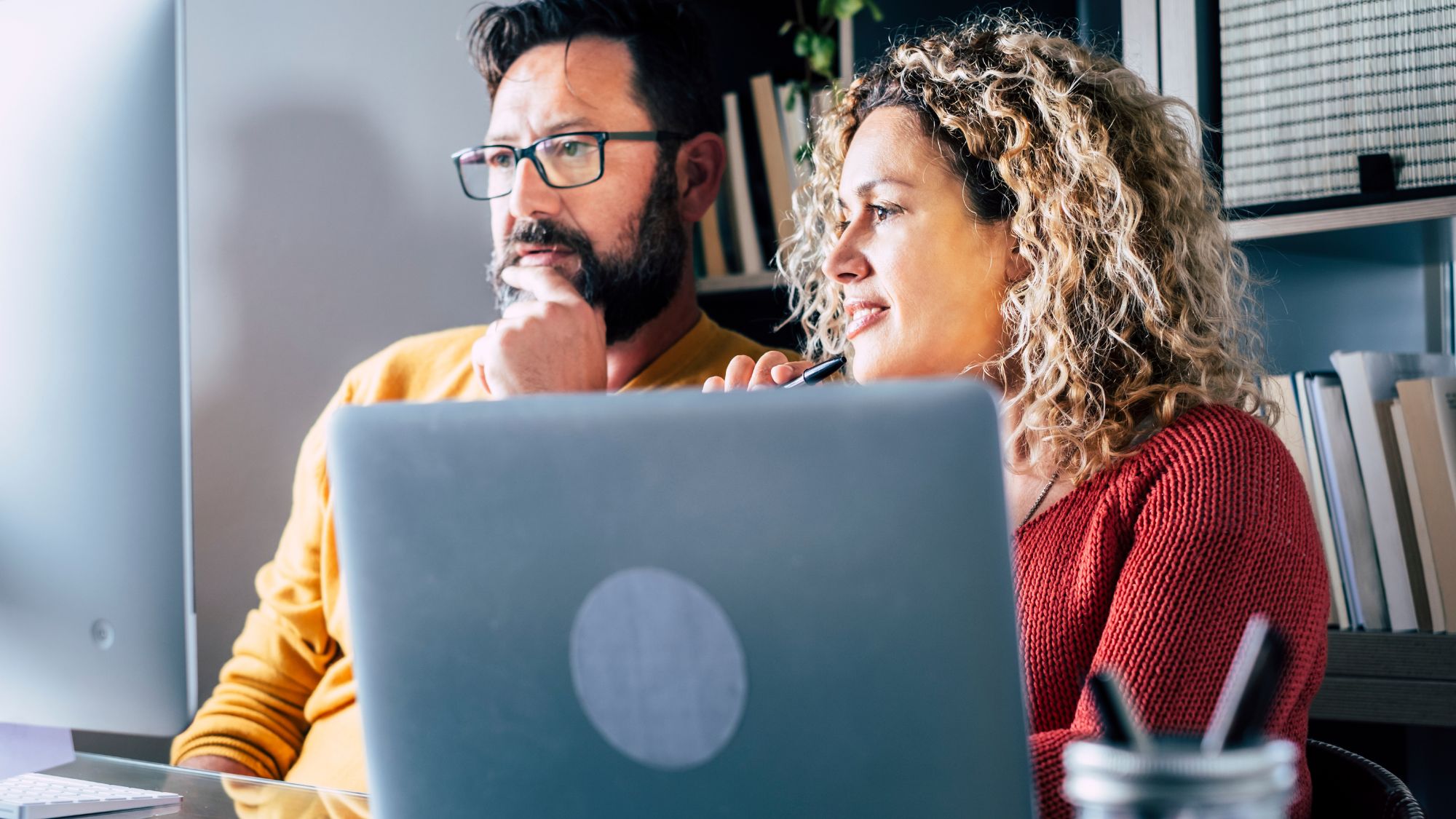 Two people listening to an advisor - QuickBooks