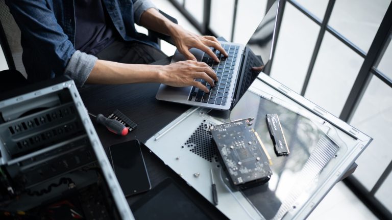 Man encoding on Laptop with CPU on this side