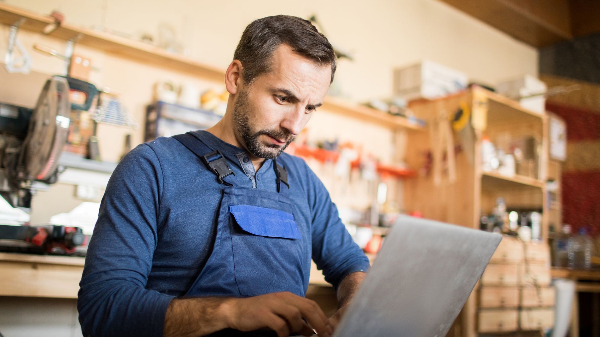 Manufacturing Staff Typing on a Laptop