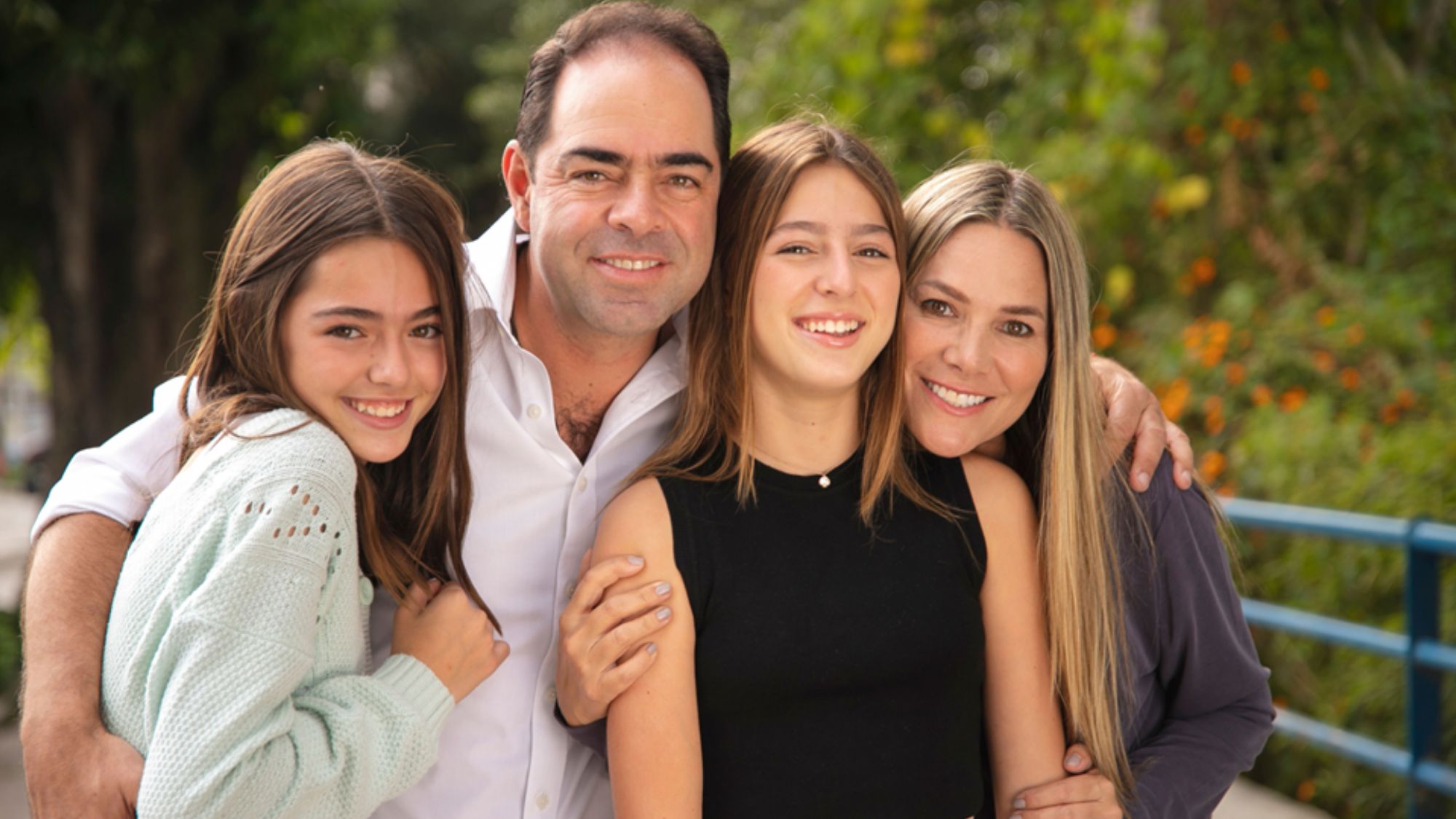 A Family Photo with Trees on the Background