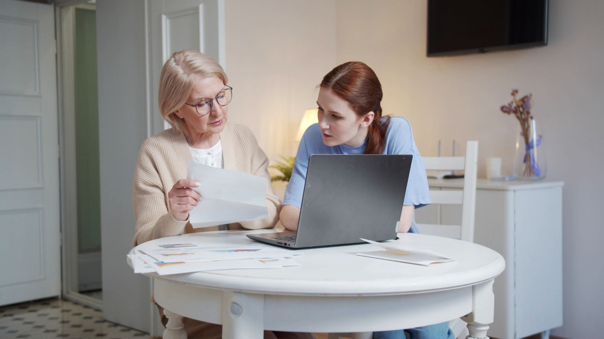 A Teenager Assisting the Elderly with Paperwork