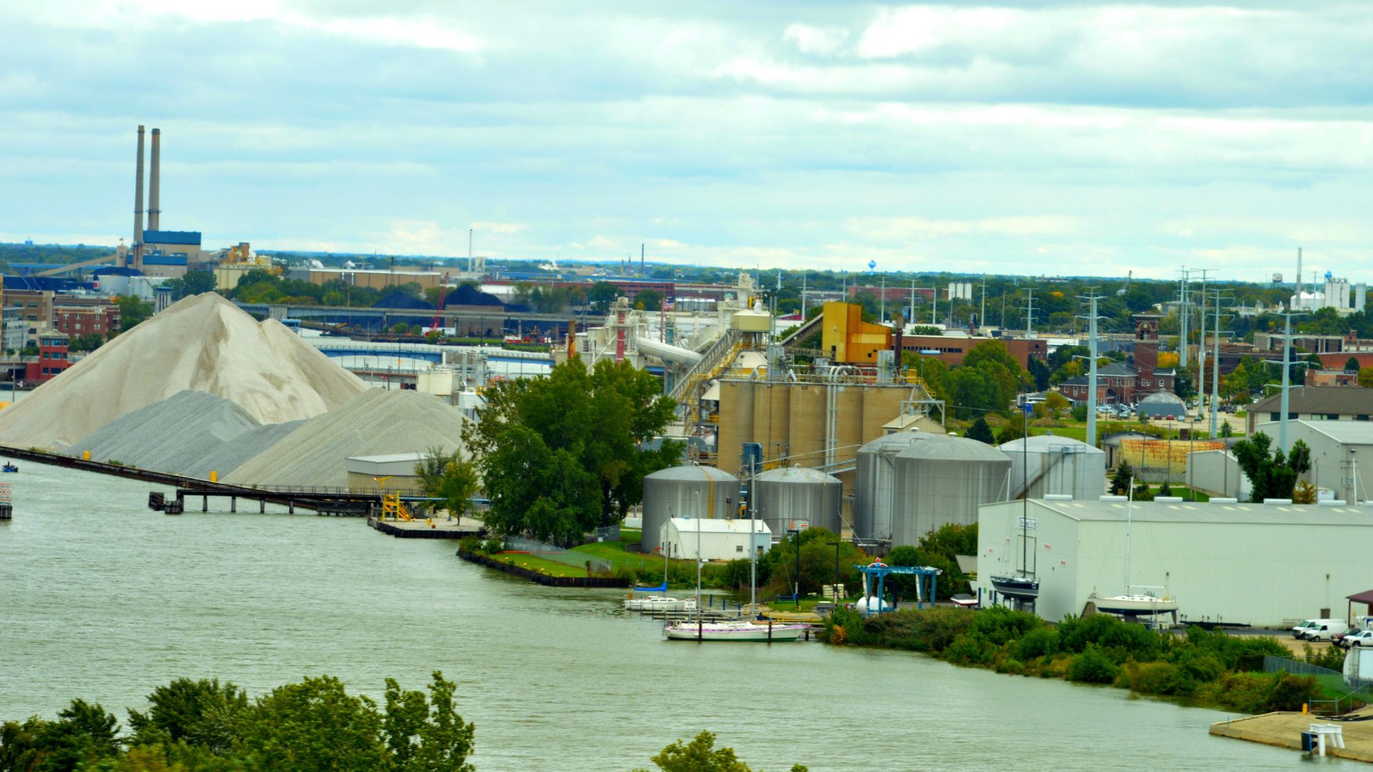 Aerial view of a manufacturing facility beside a body of water