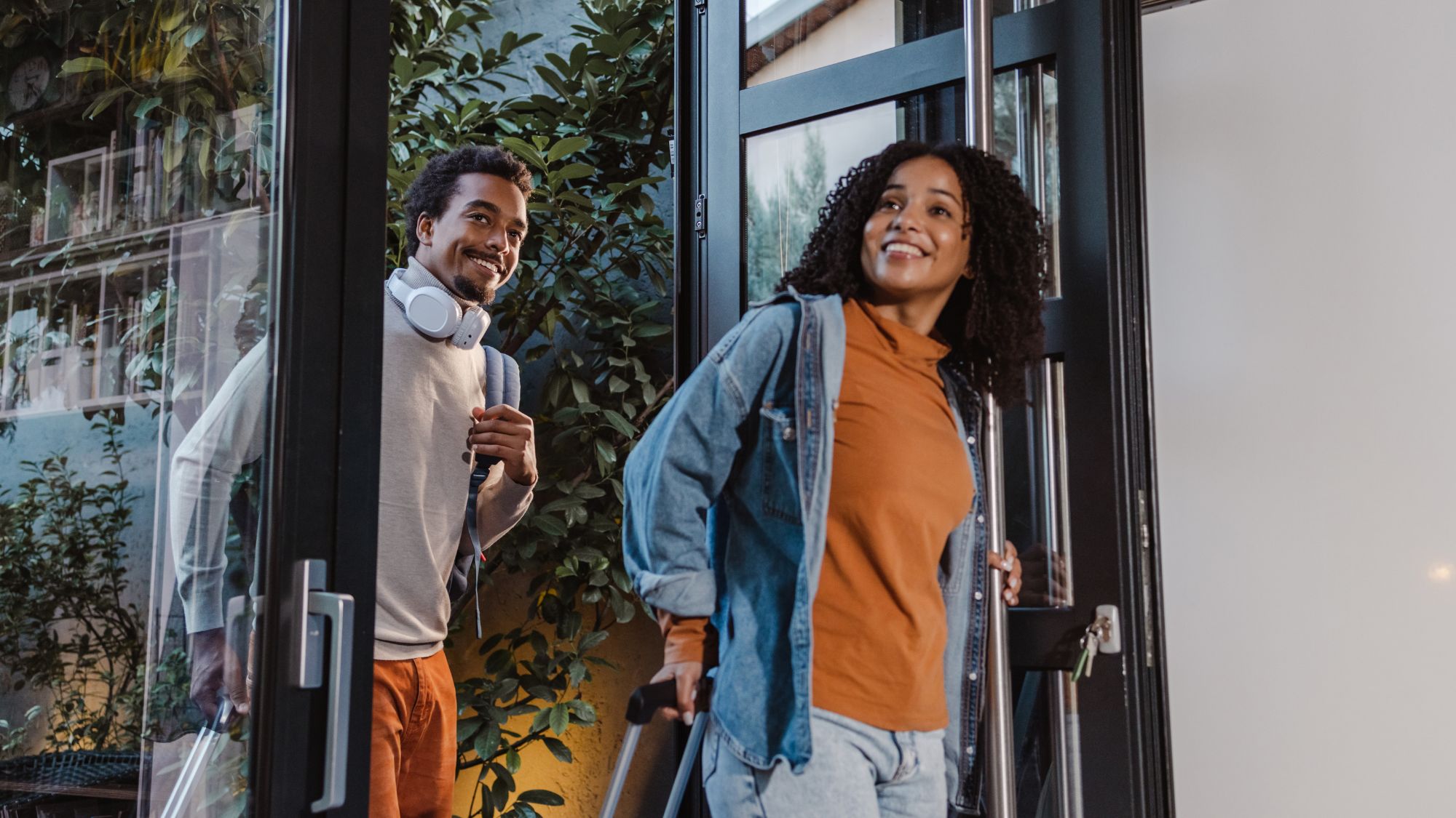 Two People Smiling at the Entrance