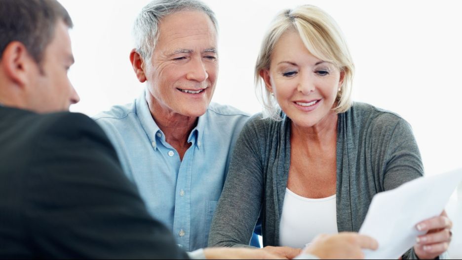 Happy Couple Talking to an Advisor