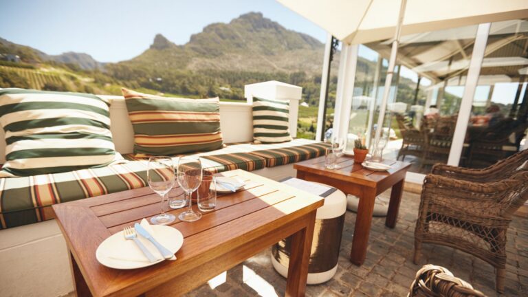 Table with utensils on top, fully prepared for a meal